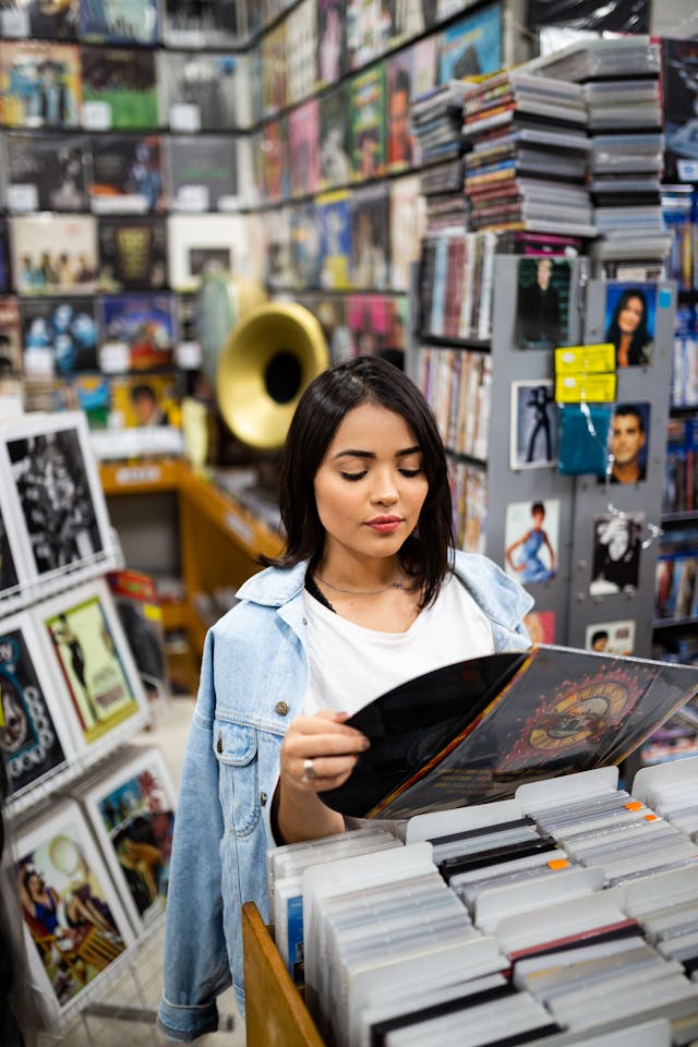 One of the co-founders of the aeonar grey music resource movement perusing in a store. Follow Aeonar Grey for more news and reesources.